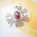 Filigree bird with ruby inlaid, precious 925. sterling silver pendant