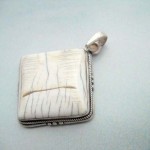 Diamond shape animal bone, 925. sterling silver mounting pendant