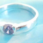Favorite 925. stamped silver ring holding amethyst rhinestone