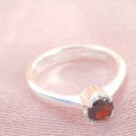 ring, 925. stamped silver ring with a round ruby cubic zirconia design 925. stamped silver ring with a round ruby cubic zirconia design