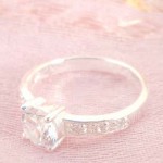 925. stamped silver ring with enlarge clear cz and decor on band design