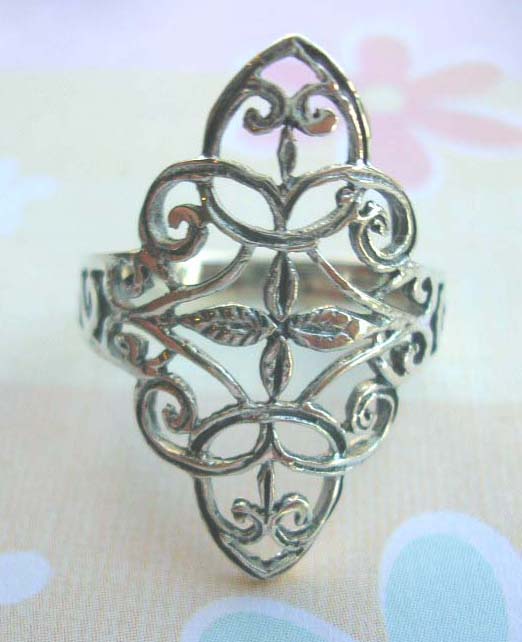 Stamped 925. silver ring with filigree garden in diamond shape