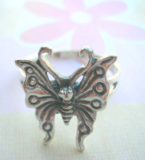 925. stamped silver ring with flying butterfly feature