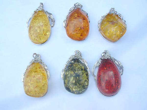 Silver plated frame holding assorted amber pendant
