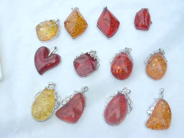 A wholesale package faux amber charm in group
