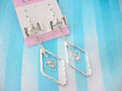 fashion accessory diamond frame holding heart earring