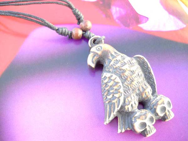 Multi string fashion eagle step on skull head resin necklace
