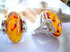 Faux fashion amber ring with clear cz holder on each sign