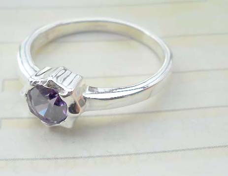 Stamped 925. silver ring with amethyst flower design