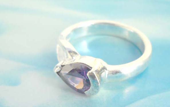 Outstanding 925. stamped silver ring with amethyst falling drop
