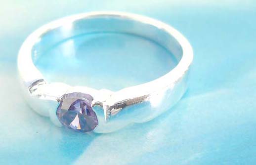 Favorite 925. stamped silver ring holding amethyst rhinestone