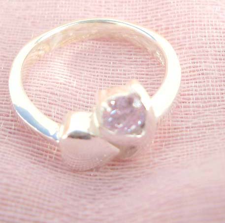 Outstanding 925. stamped silver ring with heart shape beside holding pinky cz design