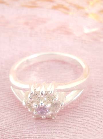 925. stamped silver ring with a multi mini cubic zirconia forming in flower design
