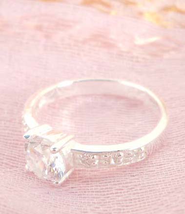 925. stamped silver ring with enlarge clear cz and decor on band design