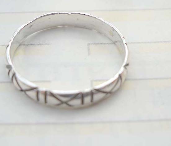 Stamped 925. silver ring with multi X design