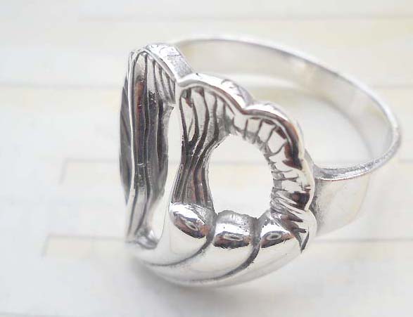Outstanding 925. stamped silver ring with filigree heart design