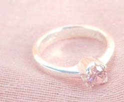 925. stamped silver ring with a round pinky cubic zirconia design