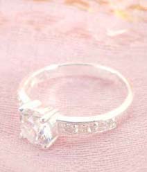 925. stamped silver ring with enlarge clear cz and decor on band design